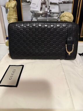 Authentic Gucci Black Leather Zip-Around Wallet with dust bag and COA.